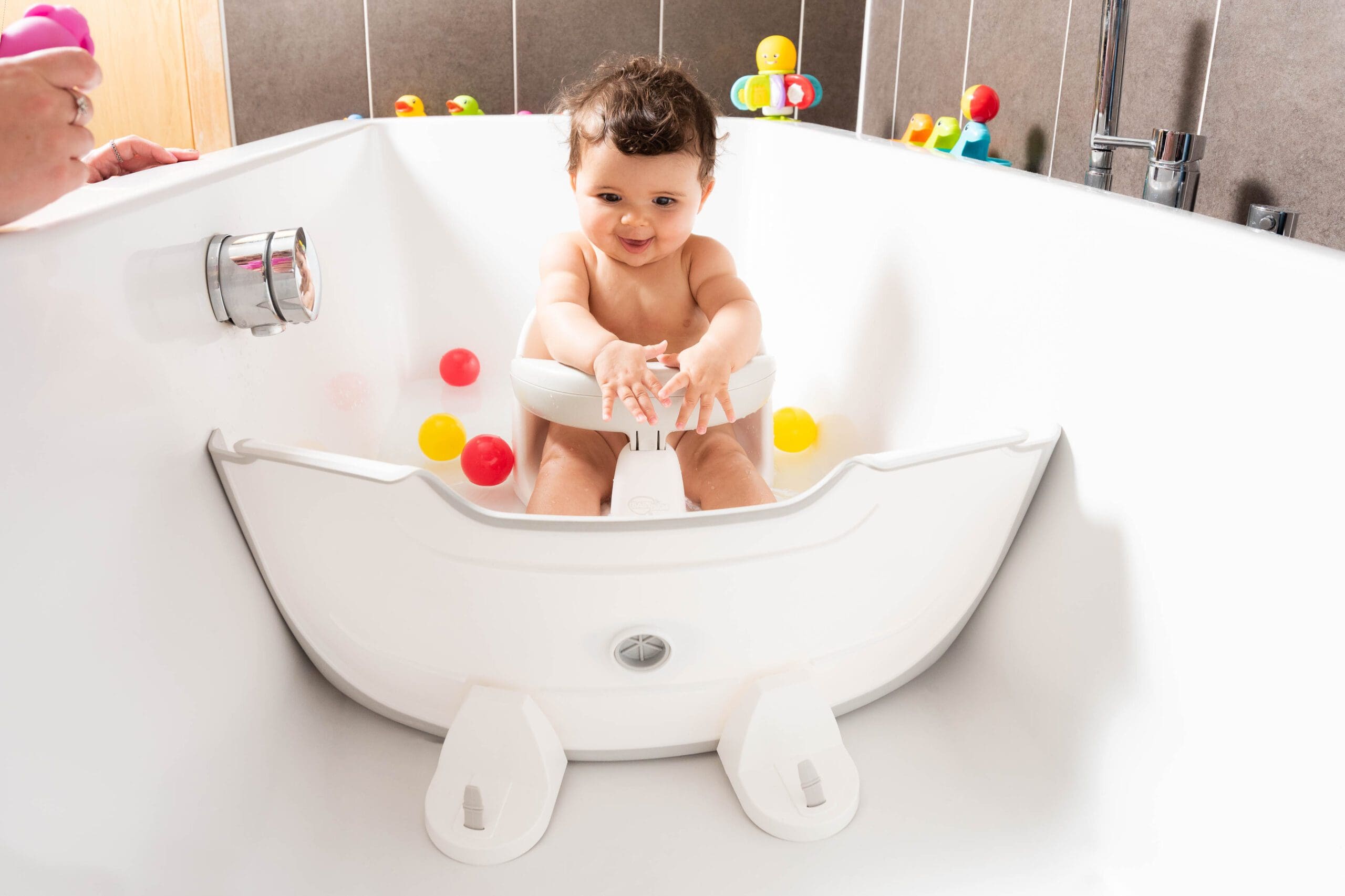 BabyDam bathwater barrier in bath with child