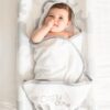 Baby using changing mat with cozytoze