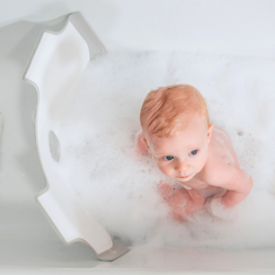 Award winning BabyDam Bathwater Barrier baby in bath