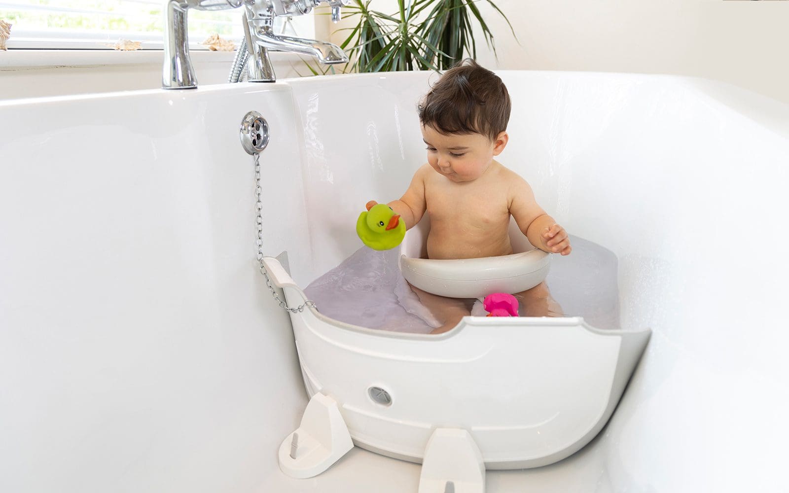 BabyDam, the original bathwater barrier fitted perfectly in a bath with taps in the middle of the bath
