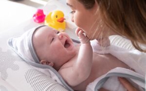 baby girl on inclined changing mat