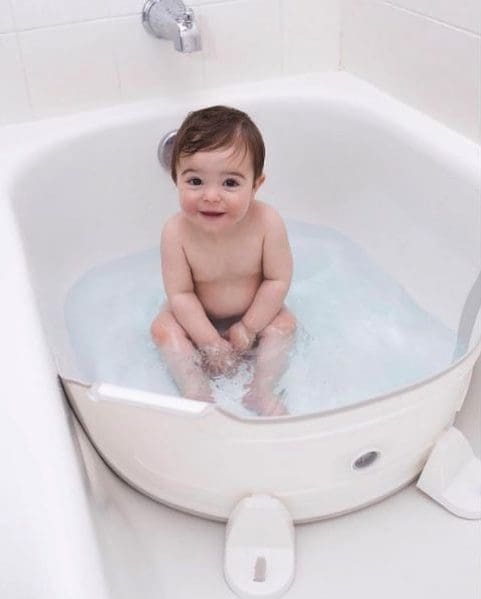 Happy baby in the BabyDam bathwater barrier.